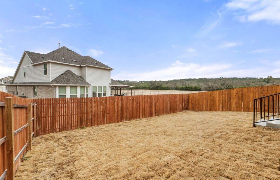 Exterior details and patio area of a home in Saddleback at Santa Rita Ranch, Liberty Hill (Image 3).