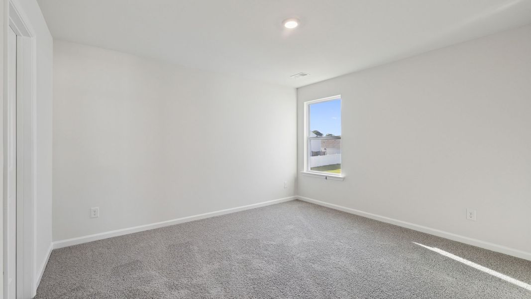 Spacious, unfurnished interior of a new home in Durbin Meadows Traditions, Fountain Inn (Image 26).