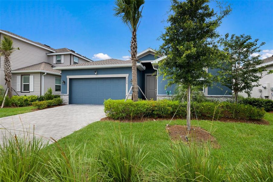 Front exterior of a new home in Rye Ranch, Parrish, FL, highlighting curb appeal (Image 23).