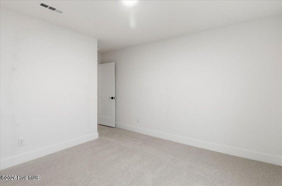 Spacious, unfurnished interior of a new home in Wood Creek Landing, Leland (Image 32).
