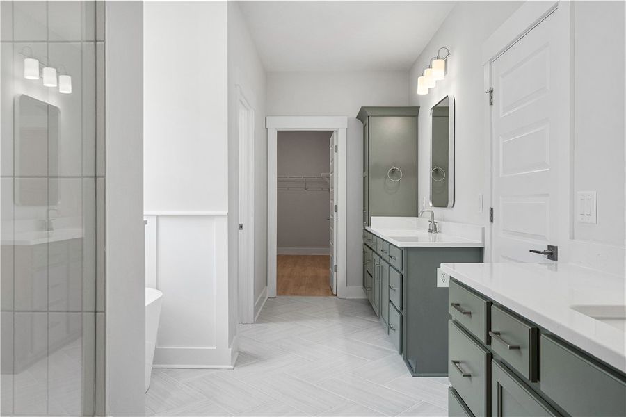 Herringbone-patterned tile flooring anchors this w Herringbone-patterned tile flooring anchors this w