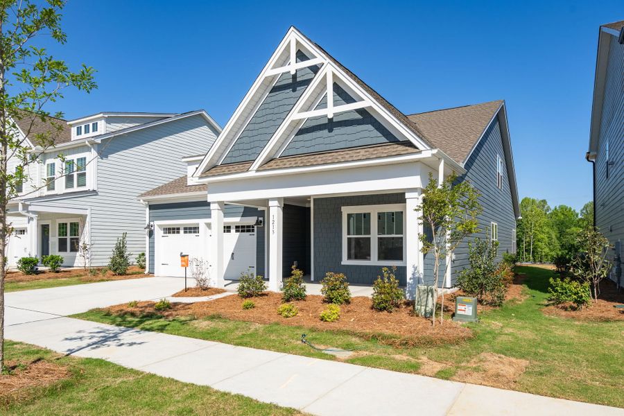 Front exterior of a new home in Parc Northwest, Elon, NC, highlighting curb appeal (Image 24). Front exterior of a new home in Parc Northwest, Elon, NC, highlighting curb appeal (Image 24).