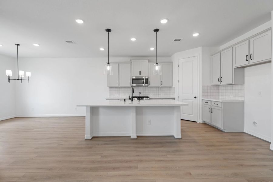 Kitchen. Note: Sample product photo. Actual exterior and interior selections may vary by homesite. Photo may be virtually staged