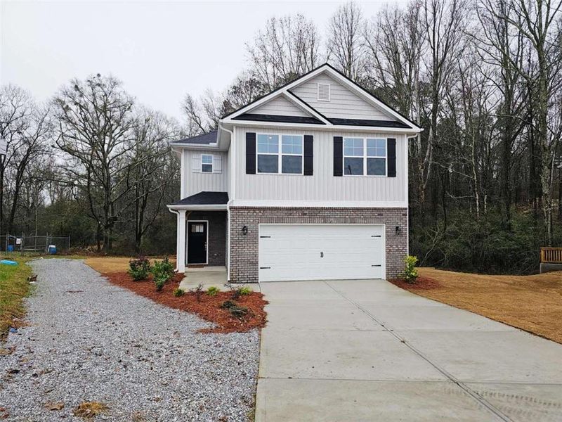 Front exterior of a new home in Scarlett Place, Bowdon, GA, highlighting curb appeal (Image 1). Front exterior of a new home in Scarlett Place, Bowdon, GA, highlighting curb appeal (Image 1).