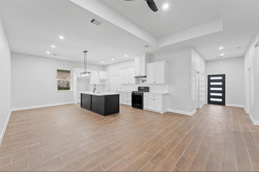 Open-concept living area filled w/ natural light, ideal for comfortable everyday living Open-concept living area filled w/ natural light, ideal for comfortable everyday living