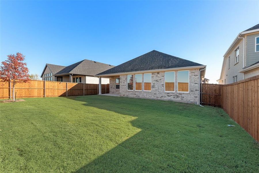 Exterior details and patio area of a home in Wildflower Ranch, Justin (Image 22).