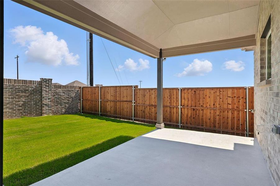 Fenced backyard featuring a patio Fenced backyard featuring a patio