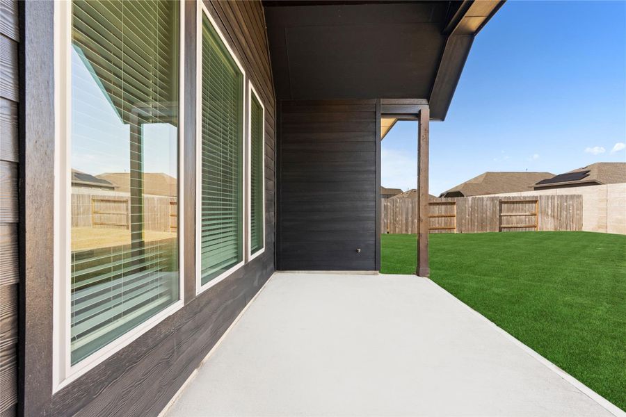 Step outside to the covered patio, a wonderful extension of the living space, ideal for outdoor dining or relaxing evenings, overlooking the fenced backyard and offering privacy and comfort for year round enjoyment.