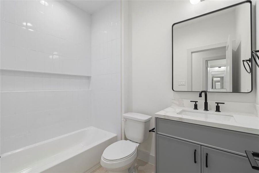 A modern and stylish ensuite bathroom, designed with both luxury and functionality in mind.