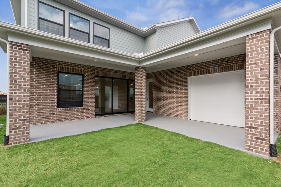 Exterior details and patio area of a home in Easthaven at Bridgeland Central - Vision Collection, Cypress (Image 4).