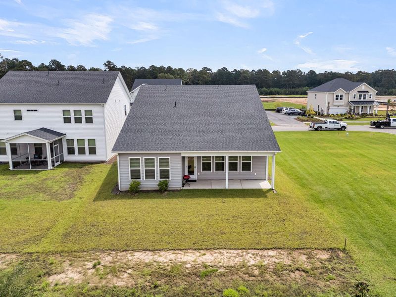 Front exterior of a new home in The Groves of Berkeley, Moncks Corner, SC, highlighting curb appeal (Image 21).