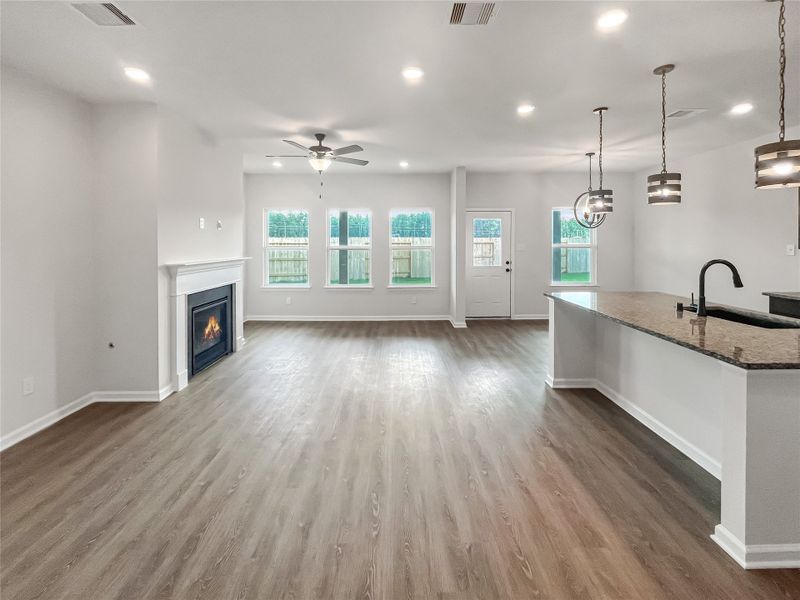 The Princeton II- Family Room with Fireplace into Kitchen.