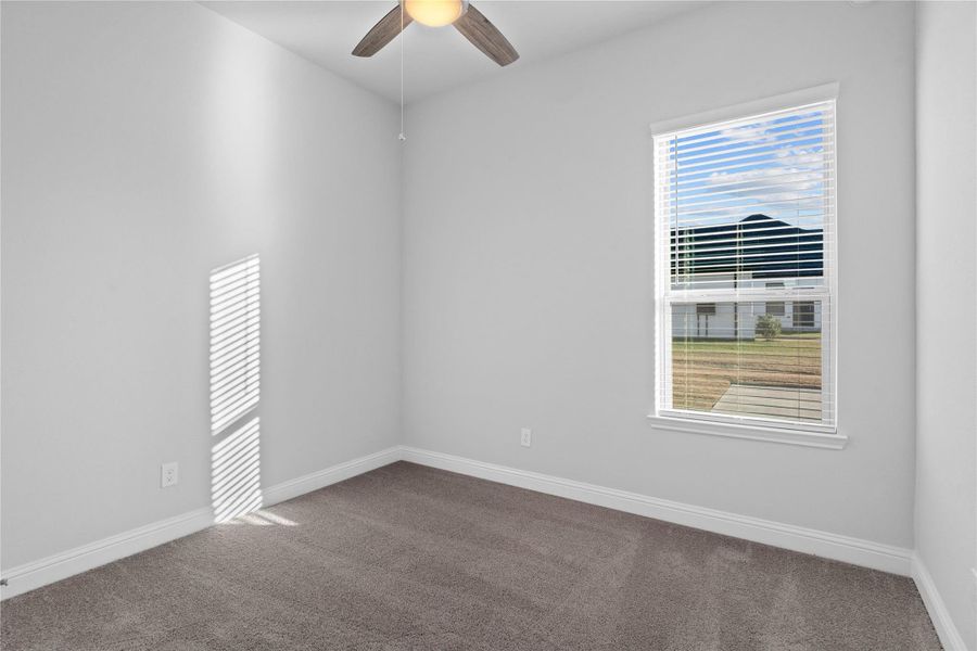 This bright secondary bedroom offers a versatile and neutral space, ideal for a guest room, home office, or quiet retreat. This bright secondary bedroom offers a versatile and neutral space, ideal for a guest room, home office, or quiet retreat.