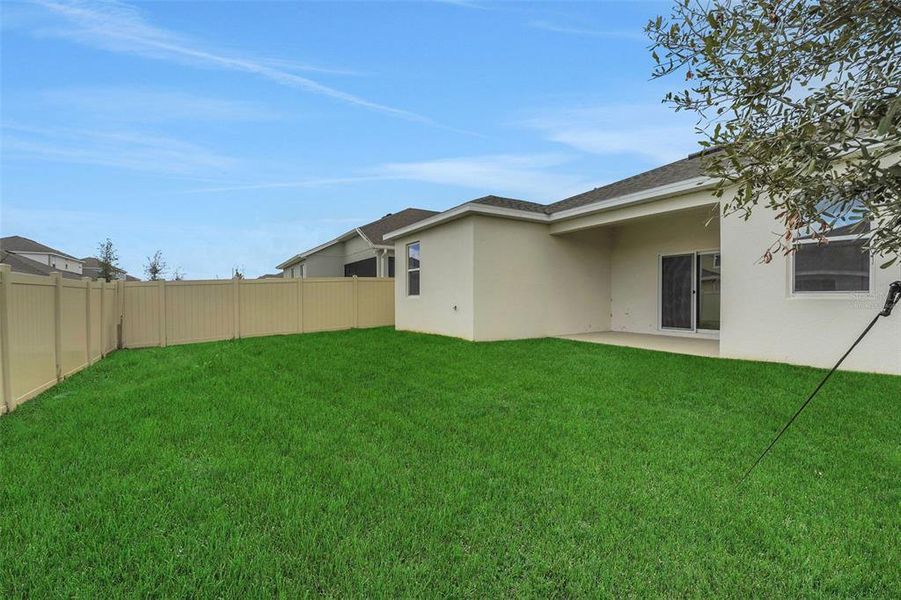Exterior details and patio area of a home in Cypress Park Estates, Haines City (Image 19).
