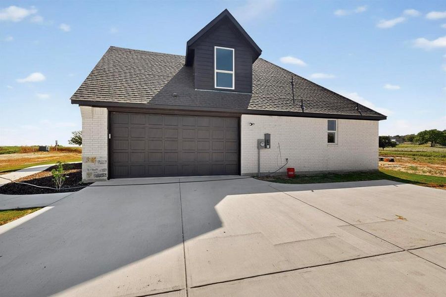 Front exterior of a new home in , Springtown, TX, highlighting curb appeal (Image 1). Front exterior of a new home in , Springtown, TX, highlighting curb appeal (Image 1).
