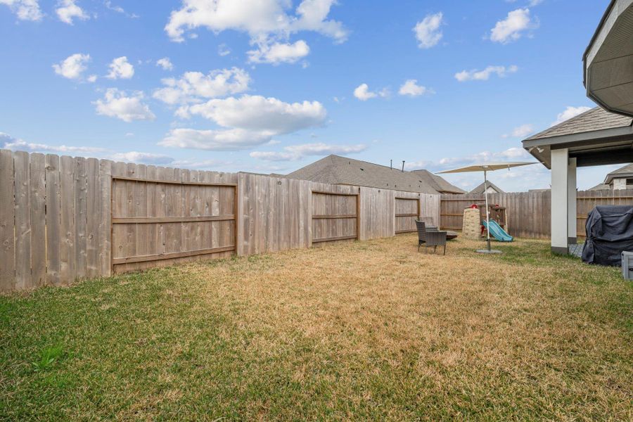 Exterior details and patio area of a home in , Conroe (Image 3).