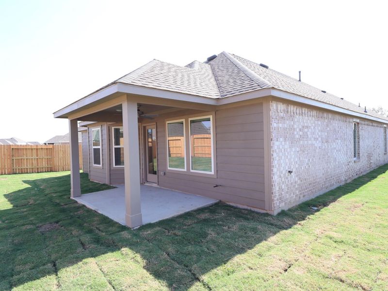 Front exterior of a new home in Sorella, Tomball, TX, highlighting curb appeal (Image 1).