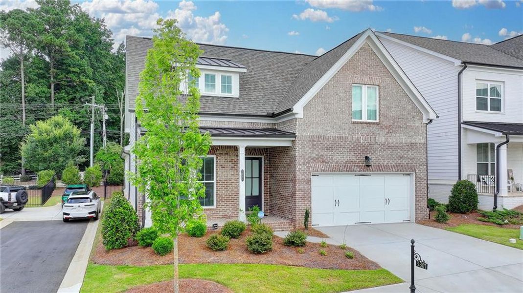 Front exterior of a new home in Ellington Townhomes, Suwanee, GA, highlighting curb appeal (Image 29).