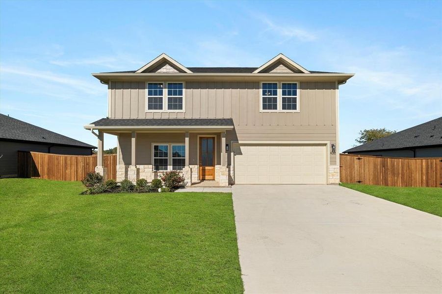 Craftsman house with covered porch, a front yard, and a garage Craftsman house with covered porch, a front yard, and a garage