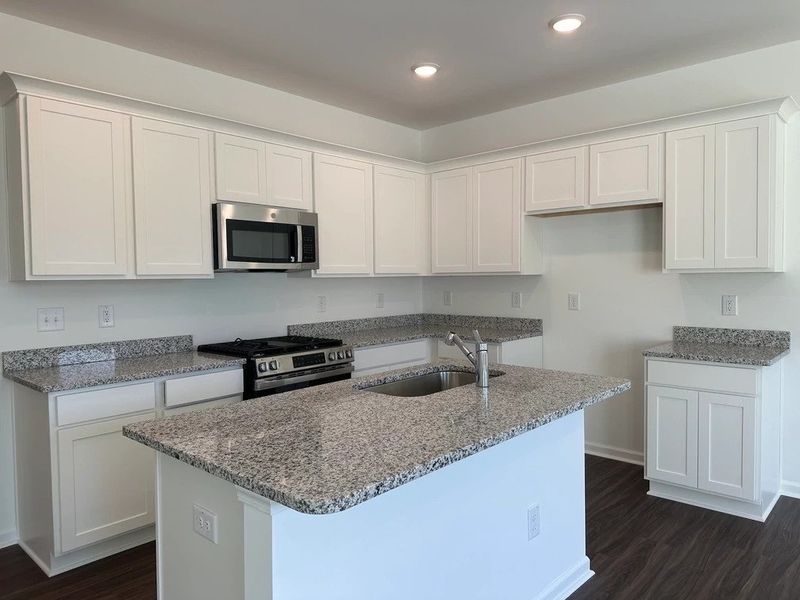 Kitchen - Chic white finishes and smooth surfaces shine. Kitchen - Chic white finishes and smooth surfaces shine.