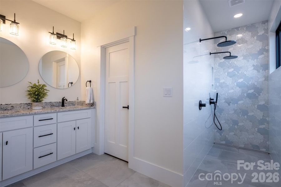 Large primary bathroom with dual sinks