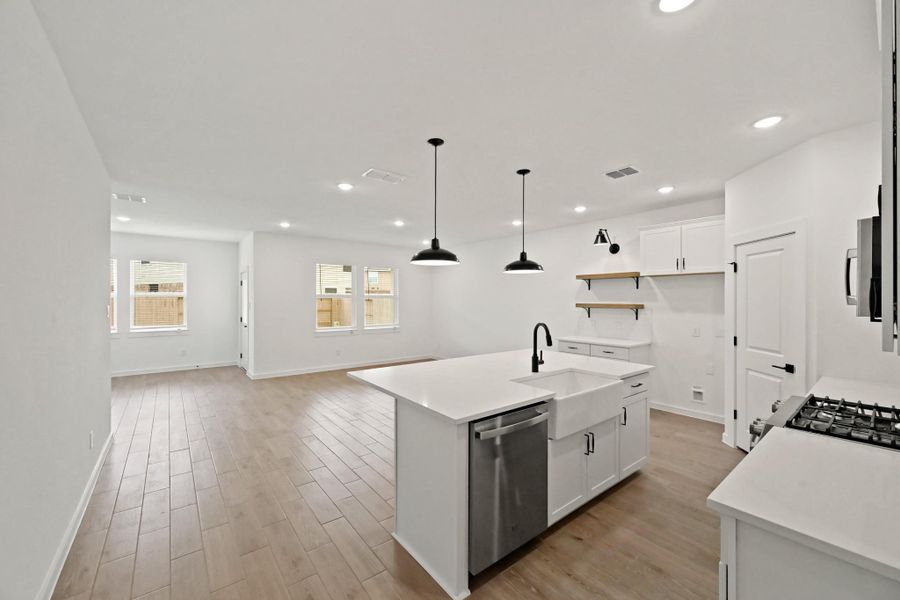 Kitchen overlooks great room and dining area Kitchen overlooks great room and dining area