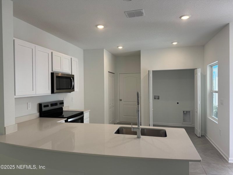 Furnished interior view inside a new home in Bridgewater, St. Augustine (Image 5).
