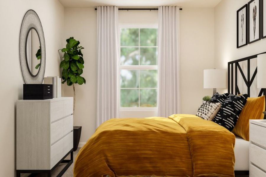 A bedroom with a bed and a mirror.