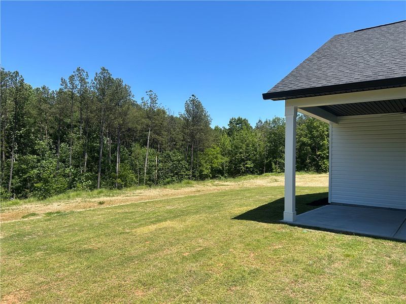 This newly constructed home features a covered pat