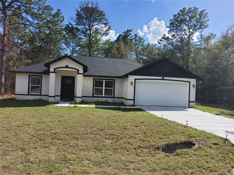 Front exterior of a new home in , Ocklawaha, FL, highlighting curb appeal (Image 22).