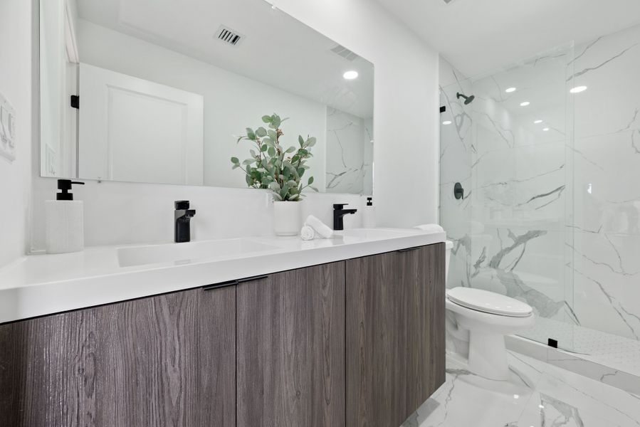 Representative furnished interior of a home built from the Model E by Onx Homes in On Alba, Florida City (Image 48).