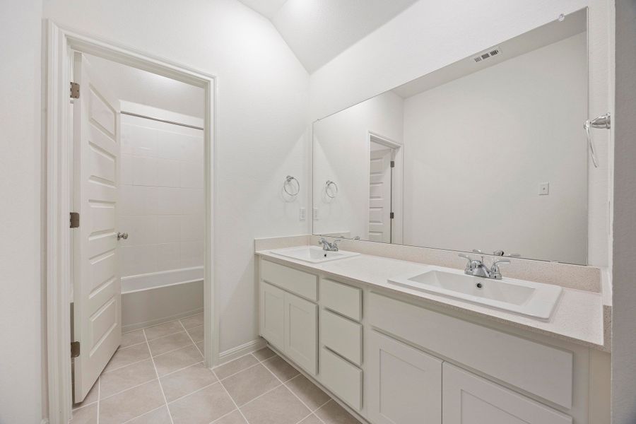 Bathroom in the Magnolia home plan by Trophy Signature Homes – REPRESENTATIVE PHOTO