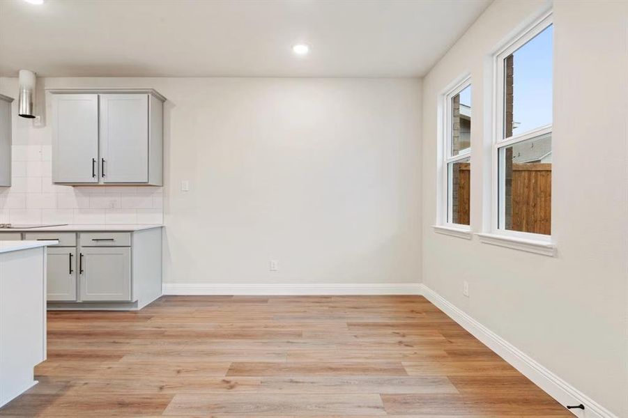 Unfurnished dining area with light hardwood / wood-style floors