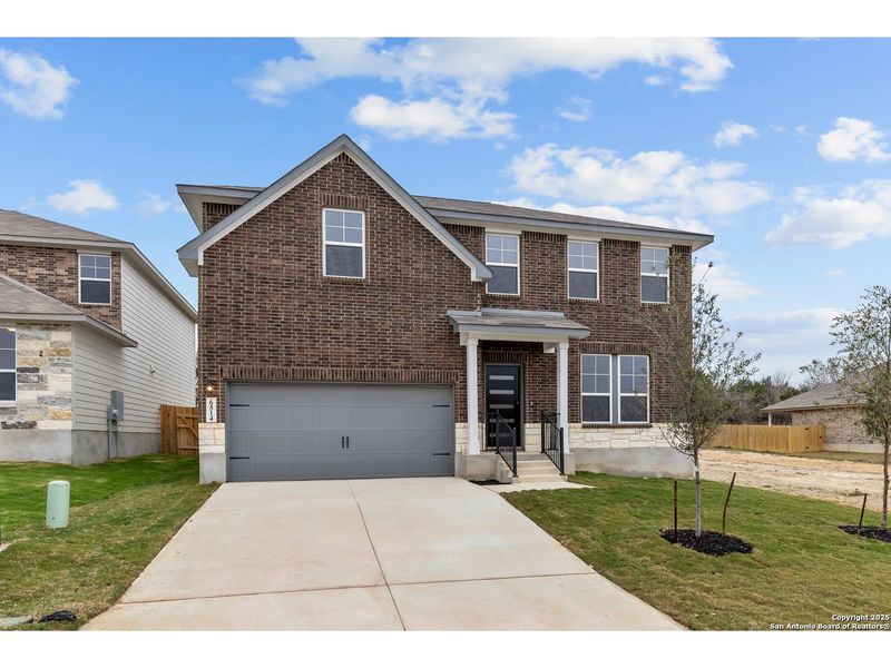 Front exterior of a new home in Royal Crest, San Antonio, TX, highlighting curb appeal (Image 1).