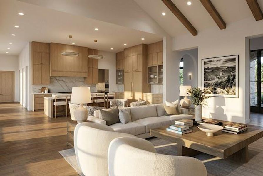 Open-concept living space featuring wood-finish flooring, vaulted ceilings with exposed wood beams, and a gourmet kitchen Open-concept living space featuring wood-finish flooring, vaulted ceilings with exposed wood beams, and a gourmet kitchen