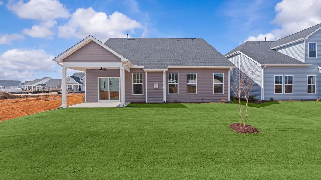 Warm and inviting outdoor living space with a covered rear porch and tasteful finishes