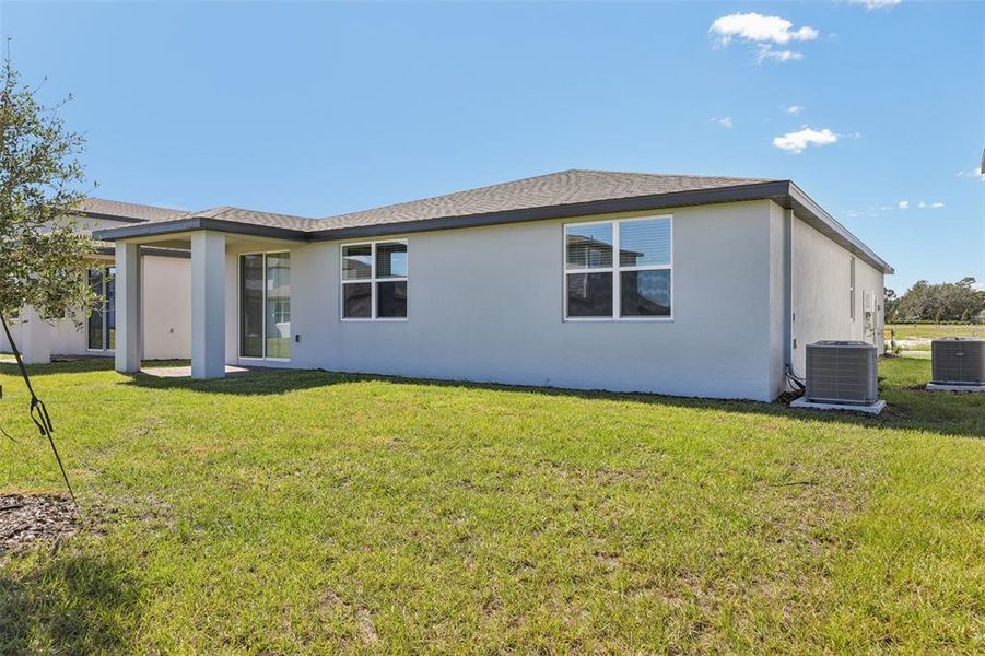 Exterior details and patio area of a home in The Reserve at Twin Lakes, St. Cloud (Image 25).