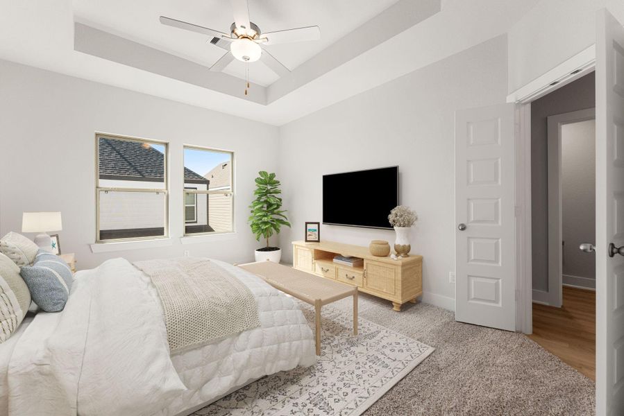 The primary suite offers a serene retreat with soft natural light, tray ceiling detail, and a neutral color palette. The spacious layout provides room for relaxation, while the en-suite bath adds convenience and comfort for everyday living. The primary suite offers a serene retreat with soft natural light, tray ceiling detail, and a neutral color palette. The spacious layout provides room for relaxation, while the en-suite bath adds convenience and comfort for everyday living.