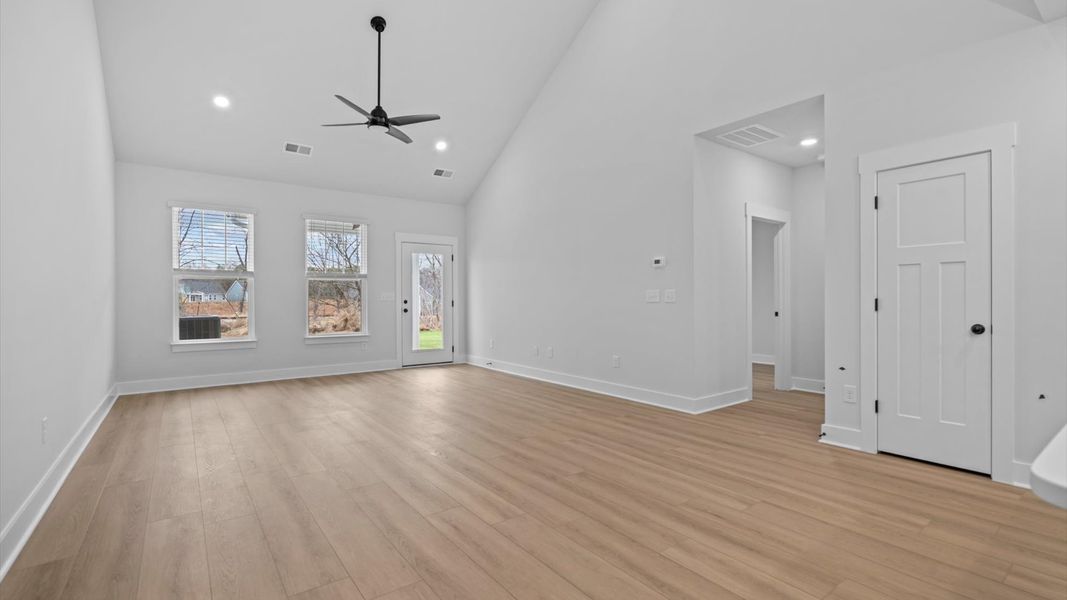 Notable two-story family room offering a grand yet inviting space for memorable everyday living