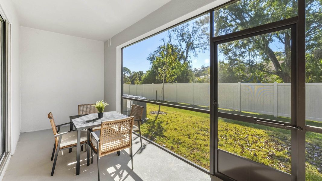 Exterior details and patio area of a home in The Gardens at Bay Street, Sarasota (Image 3).