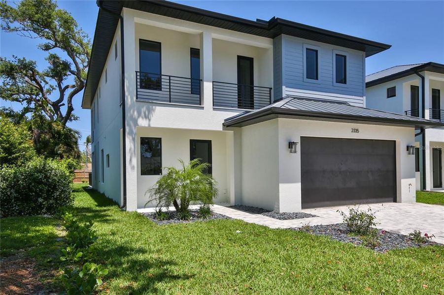 Front exterior of a new home in , Sarasota, FL, highlighting curb appeal (Image 2). Front exterior of a new home in , Sarasota, FL, highlighting curb appeal (Image 2).