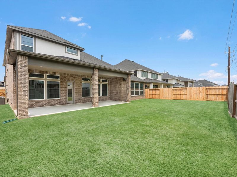 Front exterior of a new home in Cross Creek Ranch 65′, Fulshear, TX, highlighting curb appeal (Image 17). Front exterior of a new home in Cross Creek Ranch 65′, Fulshear, TX, highlighting curb appeal (Image 17).