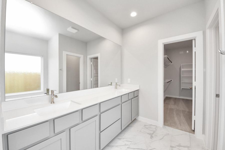 Elevate your daily routine at the elegant vanity, now equipped with double sinks, light countertops, modern hardware, and beautiful recessed lights. Elevate your daily routine at the elegant vanity, now equipped with double sinks, light countertops, modern hardware, and beautiful recessed lights.