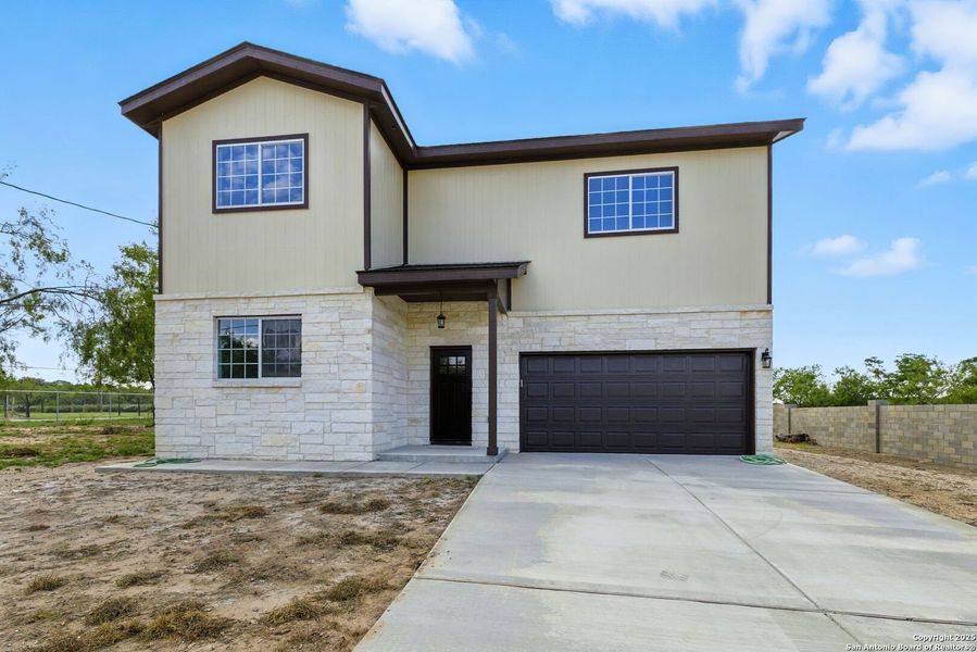 Front exterior of a new home in , Lytle, TX, highlighting curb appeal (Image 22). Front exterior of a new home in , Lytle, TX, highlighting curb appeal (Image 22).