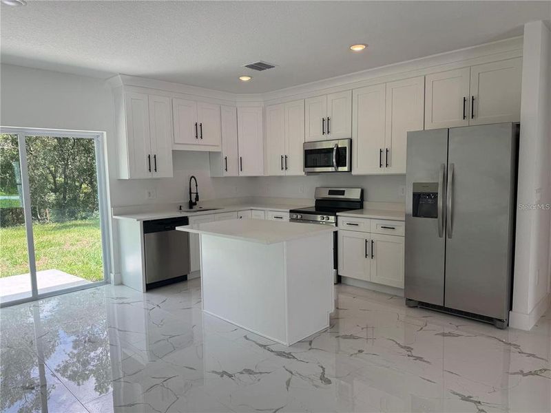 Furnished interior view inside a new home in , Dunnellon (Image 4).