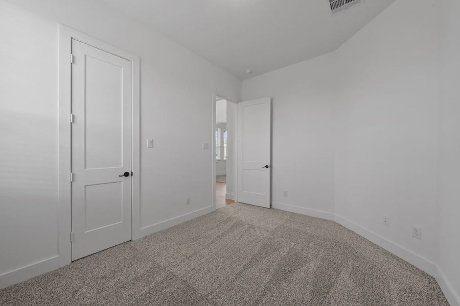 Representative unfurnished interior of a home built from the Augusta by Chesmar Homes in Riceland Alley Loads, Mont Belvieu (Image 23).