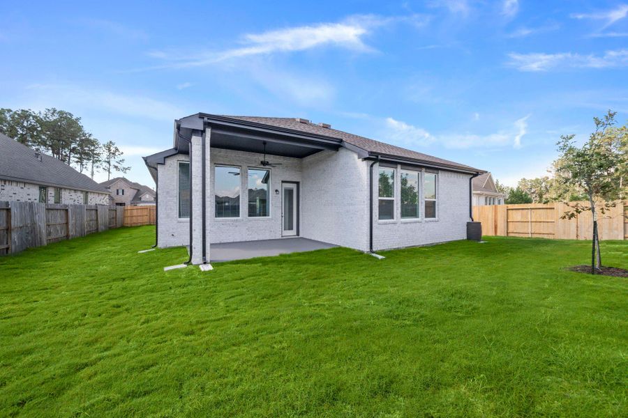 Exterior details and patio area of a home in Artavia, Conroe (Image 2).