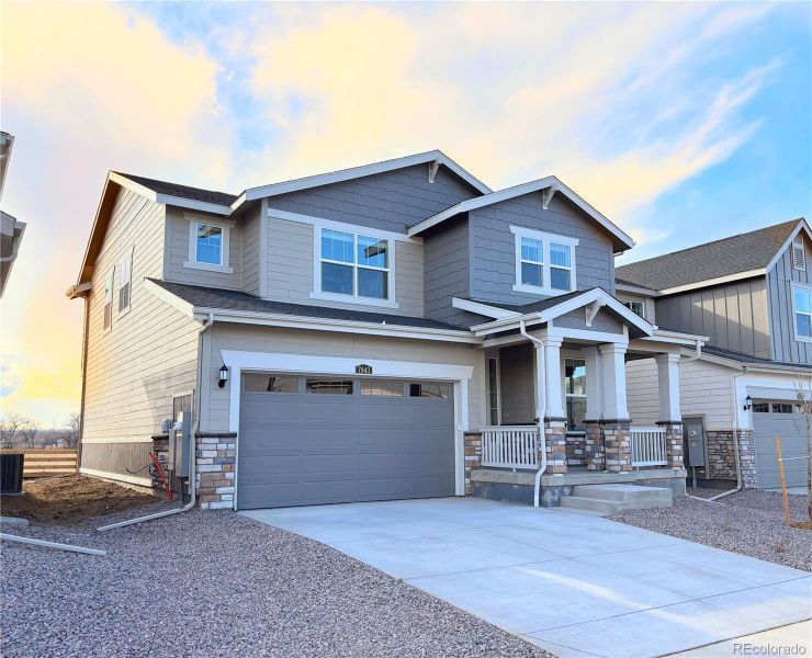Front exterior of a new home in Vermilion Creek, Centennial, CO, highlighting curb appeal (Image 2).