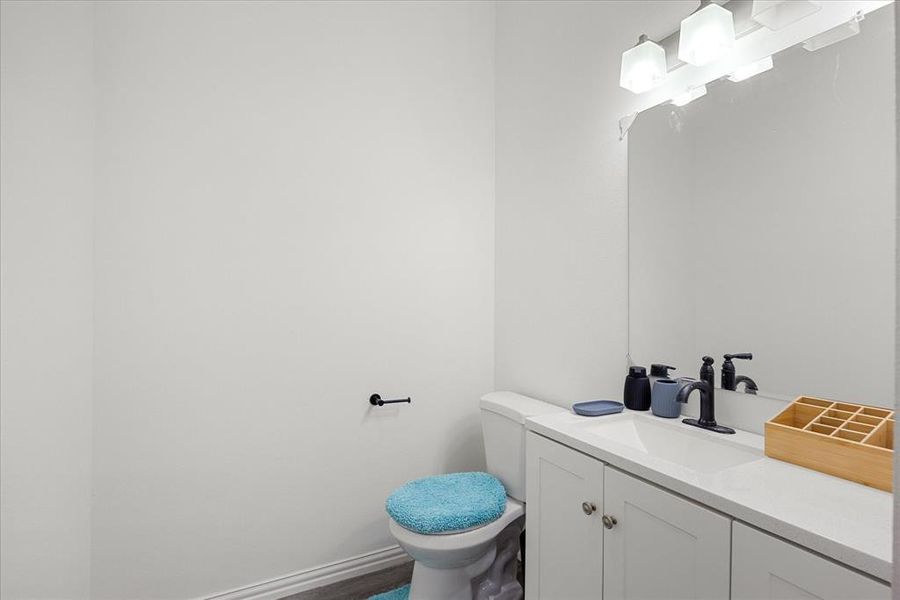 Bathroom with vanity and toilet