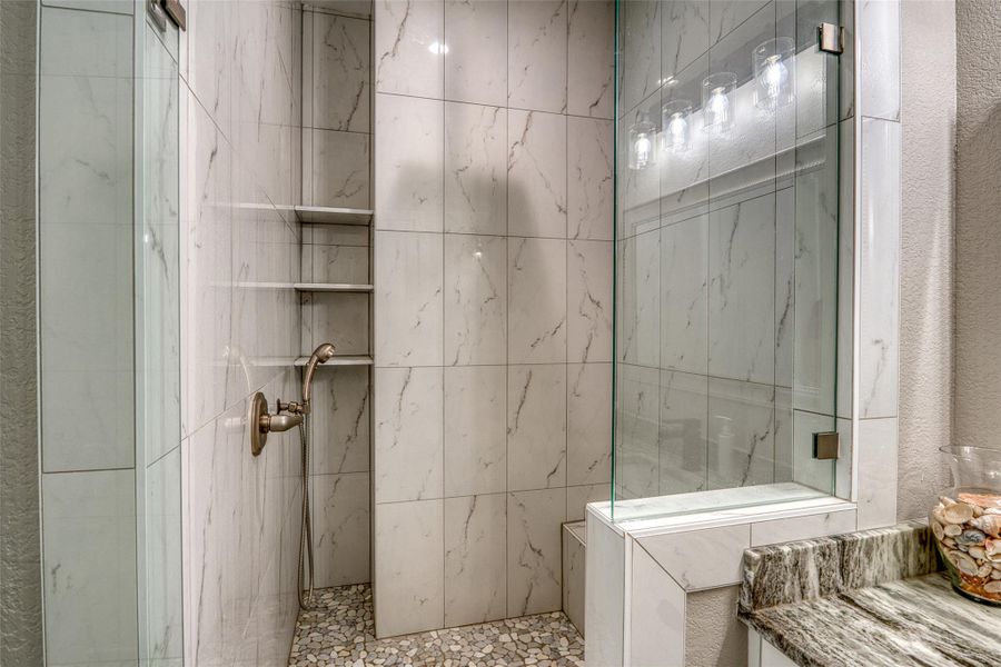 Full bathroom featuring a marble finish shower